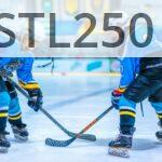Two young athletes face-off during an ice hockey game in an indoor rink.
