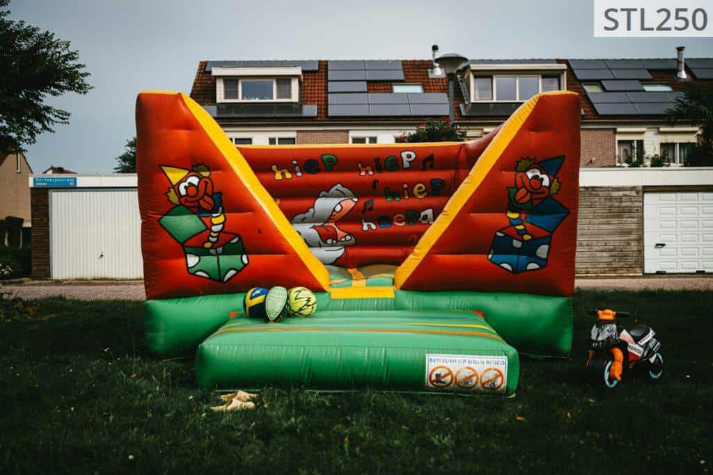 a large inflatable bouncer in a yard