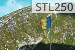 Romanian flag waves atop a scenic mountain landscape under a clear blue sky.